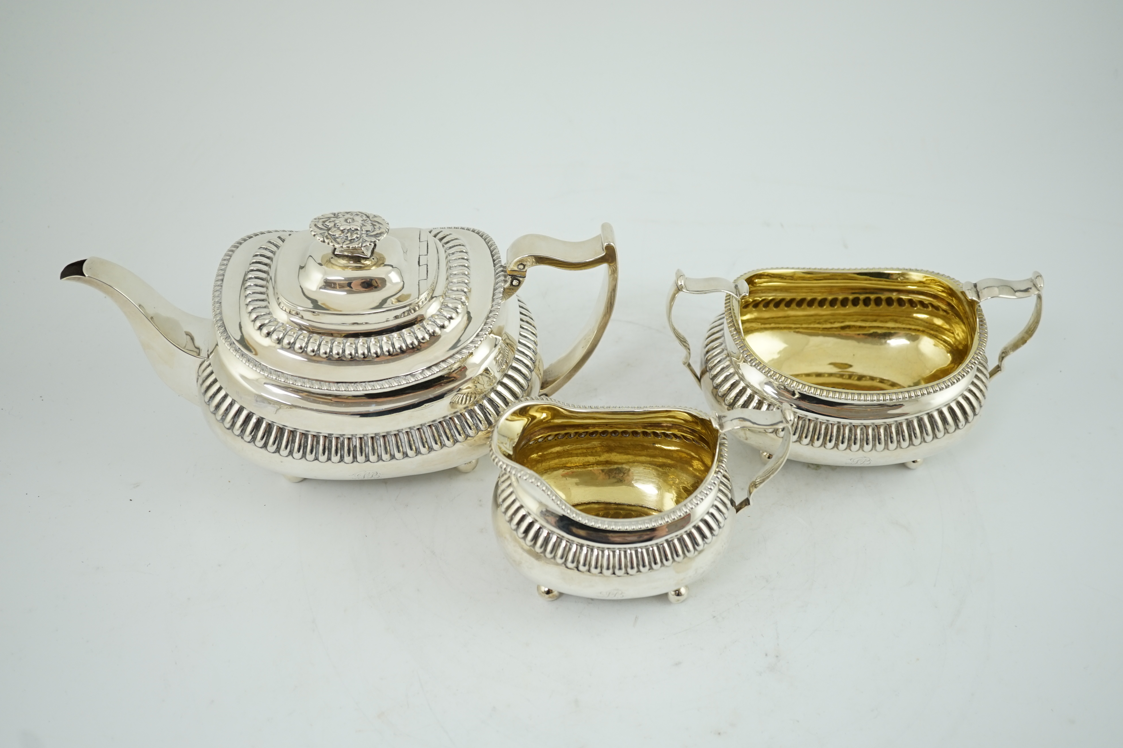 A George III silver three piece tea set, by Soloman Hougham